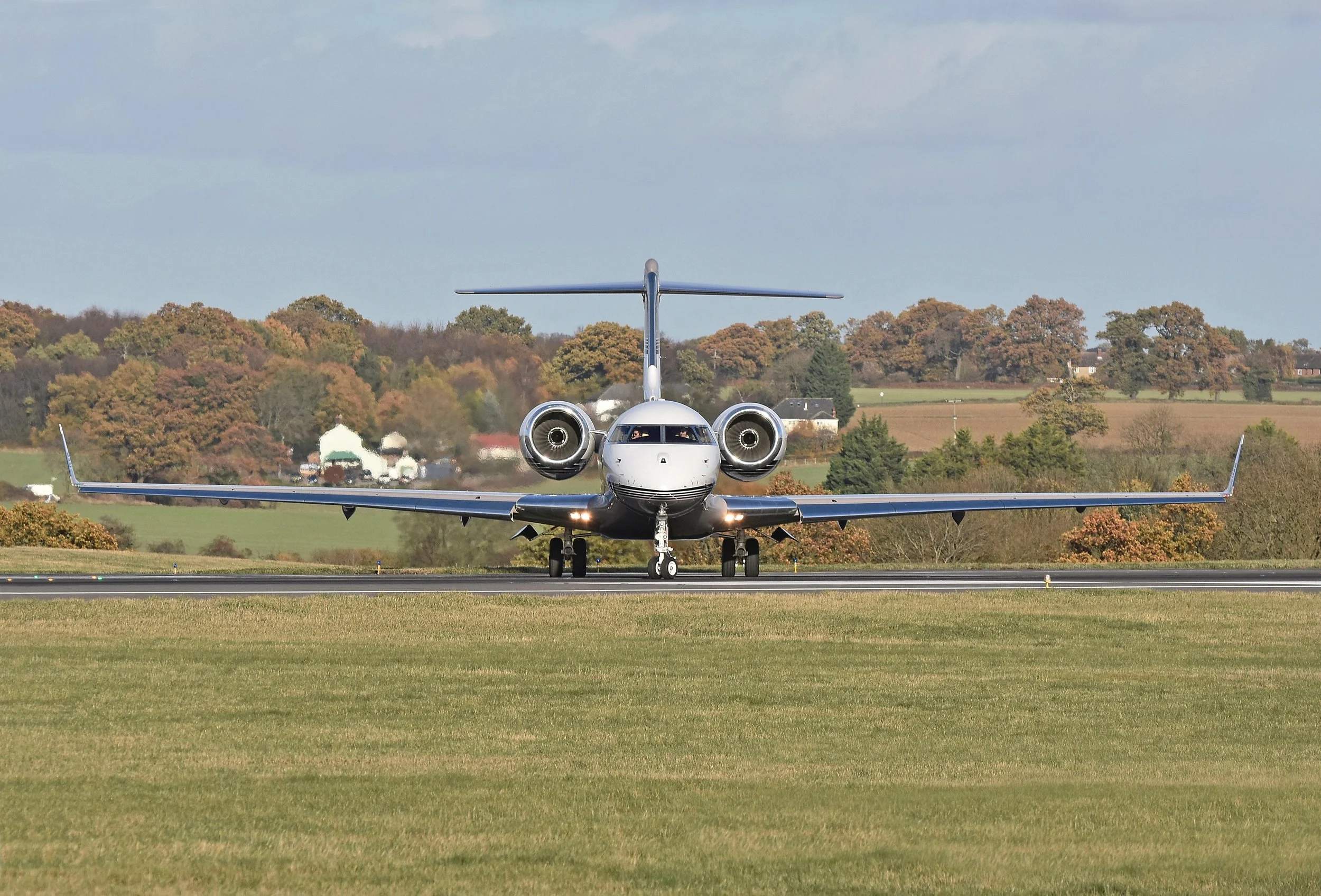 Bombardier Global business jet head on at the runway threshold